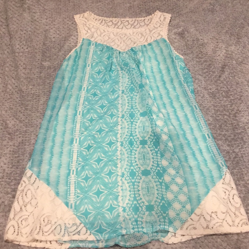 Light blue top.